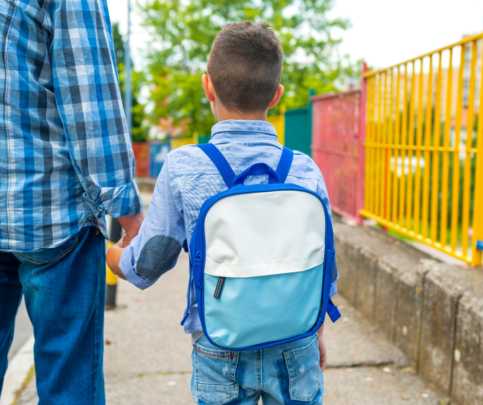 October boy with backpack